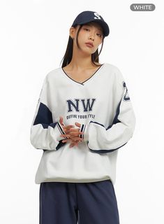 Product Detail Style : Acubi Occasion : Back to school Type : Sweat Print : Lettering Material : Cotton Sleeve : Long sleeve Neck : V neck Length : Long Fit : Loose fit Cotton100 Color : White Made in Korea Model Size Model is wearing size M/L and the color White. Height : 5'6" | 167cm / Top : S / Bottom : S (26 inch) .prddescription table, .prddescription td, .prddescription th { border : 1px solid black; border-collapse : collapse; padding: 10px; } Size(Inch) Size Shoulder Bust Sleeve Length Armhole Sleeve Width Sleeve Hem Hem Total Length M/L 24.4" 49.2" 24.2" 11.0" 9.8" 4.3" 15.6" 29.7" - The measurement can vary by 1-3 cm or 1-1.5 inches, depending on how it was measured. Size(CM) Size Shoulder Bust Sleeve Length Armhole Sleeve Width Sleeve Hem Hem Total Length M/L 62 cm 125 cm 61.5 c Winter Varsity Long Sleeve T-shirt, Oversized V-neck Sporty Sweatshirt, Casual V-neck Sweatshirt For Streetwear, Cotton V-neck Sweater For College, Sporty Cotton V-neck Sweatshirt, White Long Sleeve Sportswear T-shirt, White Long Sleeve College Sweater, White Long Sleeve Sweater For College, Casual V-neck College Sweatshirt