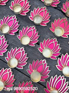 pink and gold lotus flower cut outs on wooden planks for wall decoration or home decor