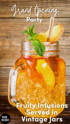 a mason jar filled with iced tea and lemons on top of a wooden table