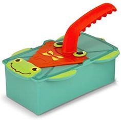 a plastic toy box with an orange and green frog on it