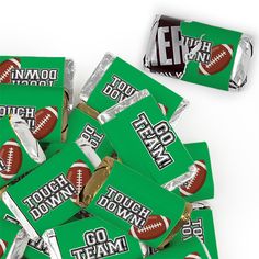 a pile of football candy wrappers sitting on top of each other