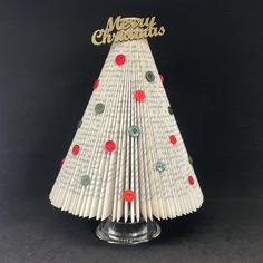 an origami christmas tree made out of books