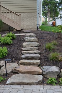 a set of stone steps leading up to a house