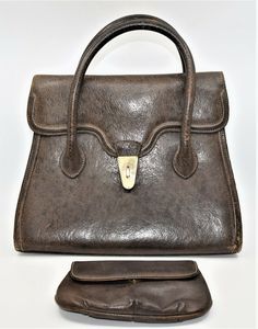 Vintage large Gucci Brown Leather Purse, Hand Bag plus Cosmetics Bag. It has a luxurious amber colored leather interior with numerous compartments: one has a zipper closure, one has a snap and the third hangs freely PLUS there is the large compartment that comprises the majority of the space. As with all Gucci bags, this is made of a very high quality brown leather with impeccable stitching, the classis Gucci logo embossed inside and 4 metal footers to protect the leather on the bottom of the ba Vintage Gucci Bag With Leather Lining, Gucci Satchel With Leather Lining For Travel, Gucci Satchel With Leather Lining, Vintage Gucci Rectangular Bag, Gucci Leather Lined Office Shoulder Bag, Gucci Leather-lined Shoulder Bag For Office, Vintage Gucci Rectangular Shoulder Bag, Vintage Gucci Tote Shoulder Bag, Vintage Gucci Top Handle Shoulder Bag