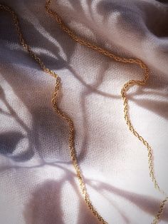 A classic everyday gold chain necklace. Vintage inspired and timeless, this dainty rope chain is made from 18kt Gold Filled and the perfect layering essential. A must have piece that never goes out of style.✦ DETAILS ✦✧ Name: Lihau (lee HA oo) - Gentle rain; cool, fresh.✧ 18kt Gold Filled.✧ All Ke Aloha Jewelry pieces come packaged thoughtfully, beautifully, and ready for gift giving.✧ Unless otherwise noted in the listing description, all pieces are sold individually. Photos with models/multipl Gold Rope Chains, Rope Chain Necklace, Necklace Vintage, Gold Chain Necklace, Rope Chain, Out Of Style, Gold Chain, Gold Chains, Jewelry Pieces