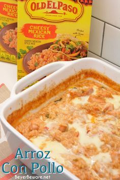 a casserole dish with cheese and meat in it next to two boxes of old el paso cheesy mexican chicken