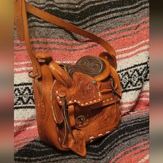 This Is A Hand Stitched One Of A Kind Mexican Saddle Bag Made Of Leather. It Can Be Used As An Every Day Purse Or As A Great Novelty Item And Conversation Piece. It Is New Without Tags. -Nwot -All Leather -Handmade/Stitched/Tooled -Satchel Open To Any/All Offers Cognac Saddle Shoulder Bag With Leather Handles, Leather Handle Saddle Bag, Brown Saddle Shoulder Bag With Removable Pouch, Cognac Saddle Bag With Leather Lining, Saddle Bag With Removable Pouch For Daily Use, Daily Use Saddle Bag With Removable Pouch, Cognac Saddle Bag With Removable Pouch, Leather Saddle Bag With Leather Lining, Brown Leather-lined Saddle Bag