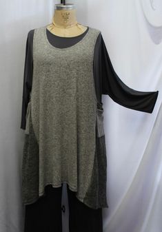 A great jumper layering tunic tank, from Coco & Juan, this is the perfect piece to add to your Lagenlook, in a mixed  knits, in Gray and White soft knit with a black mixed knit contrasting sides and pockets. One Size fits 1X,2X,3X Bust: 62" Length of top at center back: 36"  Hips: 72" With deep arm holes, a scoop neck and side patch pockets. Amp up your outfits by layering this easy to wear layering top, perfect for dressy or casual. I'm showing this beautiful,  piece over the gray drape top, wi Fitted Tunic For Layering, Fall Sleeveless Lagenlook Top, Lagenlook Sleeveless Top For Fall, Grey Drapes, Drape Top, Plus Size Tunic, Draped Top, Layered Tops, Plus Size Top