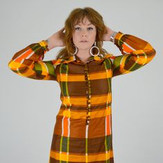 "Stunning 1970's plaid maxi dress! Made in a bold Autumn toned plaid pattern. Made in a super soft cotton material. The cotton has a pretty sheen to it, much like a polished cotton. Pointed collar, button down bodice / collar. Balloon sleeves with buttons at cuffs. Unlined. ♥♥ Fits Like: XS - Small TAG: -- BRAND: -- Excellent Vintage Condition: ♥ MEASUREMENTS; Bust: 33\" Waist: 31\" Hips: 40\" Length: 54.5\" Shoulder seam to seam: 14\" Underarm seam: 18.5\" Measurements of Model: Bust: 35\" Wais Fitted Retro Plaid Dress For Fall, Retro Plaid Mini Dress, Plaid Maxi Dress, Of Model, Vintage Store, May 23, Balloon Sleeves, Colorful Fashion, Plaid Pattern