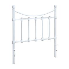 a white headboard with four posts and two knobs on the top, against a white background