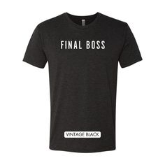 Level up your wardrobe with our "Final Boss" T-shirt, a must-have for gaming aficionados and style-savvy champions alike. Made for those who tackle life's challenges with the strategy and grit of a seasoned gamer, this tee is not just an item of clothing; it's a badge of honor. Product Features: Premium Heather fabric for a soft feel and durable wear. Bold "Final Boss" statement print, signifying your unrivaled status. Classic unisex fit that suits all body types, providing comfort and style. Id Black Tri-blend T-shirt With Team Name, Fitted Cotton T-shirt With Team Spirit Style, Tri-blend Crew Neck T-shirt With Logo Print, Sporty Fitted T-shirt For Game Day, Black Slogan Tops For Fan Merchandise, Black Tri-blend Tops With Text Print, Fitted Cotton T-shirt For Game Day, Black Tops With Text Print, Team Spirit T-shirt With Slogan For Fans