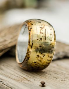 Resin Bangle Bracelet, Music Bracelet, Vintage Music Notes Bangle That is a copy of an old vintage music note paper. The music notes flow all around the bangle, so you may feel the Symphony when you wear it.There is a silver foil from the inside of the bangle that makes the note paper more shiny. Wide Thick bangle - Height of the bangle - 4.7cm/1.85inches Our jewelry always comes with a special handmade packing for a present and a greeting card that can have a text given by you. That is free of Music-themed Bracelet Jewelry Gift, Music-themed Band Jewelry As Gift, Music-themed Band Jewelry Gift, Vintage Music Notes, Music Note Bracelet, Music Bracelet, Avant Garde Jewelry, Resin Bangles, Transparent Resin