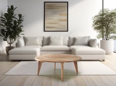 a living room with white couches and potted plants on the floor in front of it