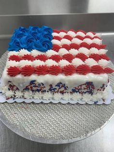 an american flag cake with red, white and blue frosting on it's side