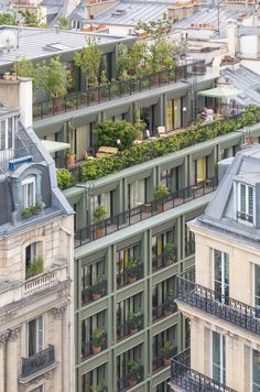 an apartment building with many balconies and plants on the balconys in paris, france