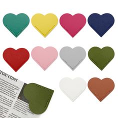 heart shaped leather coasters with stitching on each one in different colors and sizes