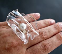 A large cocktail ring made of plastic, incredibly similar to glass, but it can not be broken. The size of the transparent disk about 5 cm, pearl size 1 cmThe base of the ring is made of 925 silver, detachable, which allows you to wear the ring on any finger. Light, stylish and beautiful ring! At your request, I can make a necklace, bracelet, earrings , brooch. All you have to do is write me a letter. Avant Garde Rings, Avante Garde Art, Asymmetrical Jewelry, Mesh Jewelry, Art Rings, Avant Garde Jewelry, Gray Jewelry, Contemporary Necklace, Art Ring