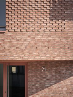 a brick building with the number twenty on it