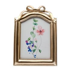 an ornate gold frame with flowers painted on the glass and hanging from it's sides