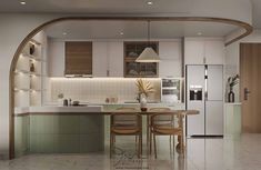 a kitchen with an archway leading into the dining room and kitchen area, along with a breakfast nook