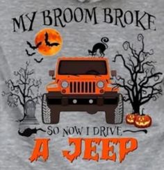 an orange jeep is parked in front of a tree with bats and pumpkins on it