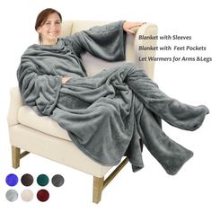 a woman laying on a couch wrapped in a blanket with multiple colors to choose from