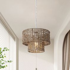 a dining room table and chairs with a chandelier hanging from the ceiling