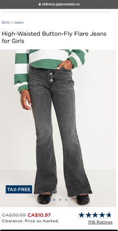 a woman wearing high - waisted button - fly flare jeans for girls from old navy