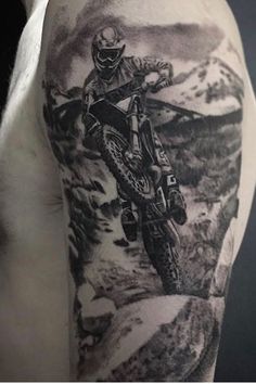 a man with a motorcycle tattoo on his arm