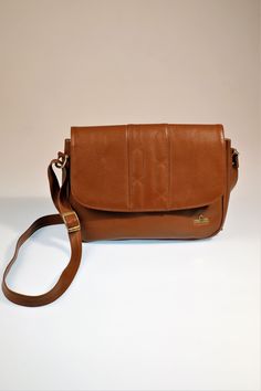 Vintage Brown Leather Shoulder Bag, Small Leather Purse, CrossBody Shoulder Bag, Brown Leather Women Pouch This beautiful bag is in a perfect condition, very stylish and timeless! MEASUREMENTS:  Width: 25 cm Hight: 21 cm Diagonal: 30 cm_ Strap Length: max 116 cm, it is adjustable The bag consist of 3 main compartmens and 3 smaller pockets. With this many pockets it is impossible not to stay organized!  Brand: Jolly Bag In case of any questions, please, don't hesitate to contact me. Small Leather Purse, Brown Leather Shoulder Bag, Brown Bags, Stay Organized, Vintage Bags, Cross Body Bag, Leather Purse, Beautiful Bags, Vintage Brown