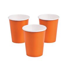 three orange cups sitting next to each other