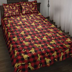 a red and black checkered bedspread with yellow smiley faces on it