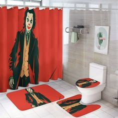 a bathroom with a red shower curtain and two rugs that have the image of joker on them