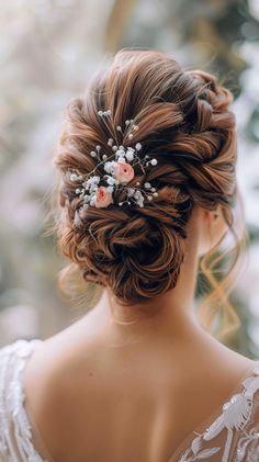 a woman wearing a wedding hair comb with flowers in it's centerpieces