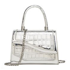 a white handbag with silver hardwares on the front and side, sitting against a white background