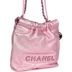 This Chanel Mini 22 Bag is in pink metallic lambskin Leather with pink lacquered metal hardware, has the signature diamond quilt, lacquered metal "Chanel" logo on front of bag, Chanel Paris metal hang tag, and a lacquered chainlink and interwoven with leather shoulder strap, and one long leather cord shoulder/crossbody strap.The interior is lined in pink fabric with one slip pocket on the rear wall.Collection: 23A (RFID)Origin: ItalyCondition: New and never wornAccompanied by: Chanel Box, Chanel dustbag, retail UPC, RFIDMeasurements: 7.8" width x 7.4" height x 2.3" depth; 21" strap drop Designer Glossy Finish Bags For Party, Designer Glossy Finish Party Bags, Designer Party Bags With Glossy Finish, Pink Quilted Leather Bag, Luxury Quilted Pouch Bag, Luxury Quilted Party Bag, Formal Pink Quilted Shoulder Bag, Luxury Pink Shoulder Bag For Evening, Pink Quilted Evening Bag