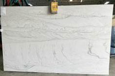 a large white marble slab in a warehouse