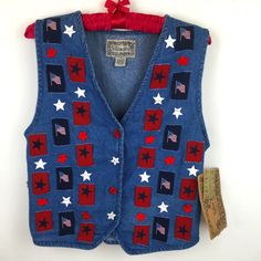 New With Tags Vintage Tantrum Blues 100% Cotton Denim Vest. Stars/Flag Patches. Star Buttons. Extra Buttons! Approximately - 18 1/2 Inches Armpit To Armpit Approximately - 21 Inches Shoulder To Hem Please Look At Photos For Details. Please Email Me If You Have Any Questions. Thank You For Shopping Our Store! Gigi And Min Patriotic Blue Tops For Fall, Floral Tunic Tops, Star Buttons, Turtleneck Sweatshirt, Flag Patches, Long Sleeve Flannel, Layered Tops, Gray Plaid, Red Blouses