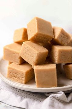 a plate full of peanut butter fudges on top of a white table cloth