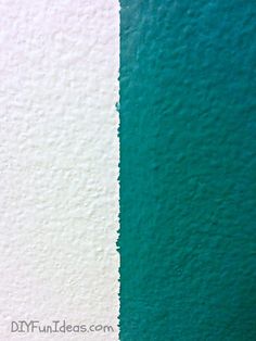 the wall is painted green and white with two different colors on it, including one blue