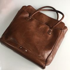 Cole Haan Leather Bag. Used, In Great Condition Inside And Out. Small Hole At The Bottom, Not Visible When Carried- See Last Picture. Classic Bag With Luggage Sleeve For Everyday Use, Brown Briefcase With Removable Pouch For On-the-go, On-the-go Bag With Leather Lining And Double Handle, Cognac Satchel With Leather Lining For On-the-go, Cognac Satchel Travel Bag For Everyday Use, Cognac Bags For On-the-go, Leather Top Handle Shoulder Bag With Luggage Sleeve, Leather Top Handle Bag With Luggage Sleeve, Leather Shoulder Bag With Top Handle And Luggage Sleeve