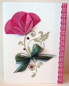 a card with an origami flower on it