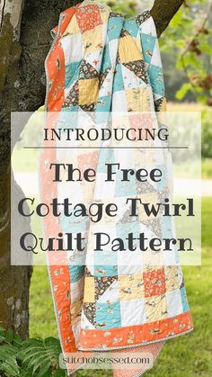 a quilt hanging from a tree with text overlay that reads,'the free cottage twin quilt pattern '