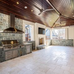 an empty kitchen with stone walls and ceiling