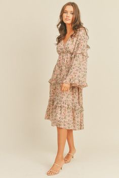 -Floral Print Midi Dress-Ruffle tiered skirt -Bell sleeves -V neckline -Tie back Floral Chiffon Midi Dress With Ruffles, Chiffon Floral Midi Dress With Ruffles, Chiffon Midi Floral Dress With Ruffles, Feminine Floral Midi Dress With Ruffle Hem, Feminine Midi Floral Dress With Ruffle Hem, Elegant V-neck Ruffle Dress With Floral Print, Elegant Floral Print V-neck Ruffle Dress, Flowy Ruffled Dress For Wedding Guest, Elegant Pink Floral Dress With Ruffles