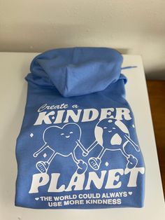 Together we can create a kinder planet by spreading kindness and love <3  Order your super soft and cozy hoodie in Carolina Blue with the white vinyl design. The sizing is unisex adult!  Note: this is a heat transfer design on the back of a hooded sweatshirt:) the front is blank! Please let me know if you have any questions! Playful Cotton Hoodie With Graphic Print, Spreading Kindness, Heat Transfer Design, Spread Kindness, Embroidery Sweatshirt, Cozy Hoodie, Embroidered Sweatshirts, Together We Can, Carolina Blue