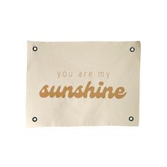 you are my sunshine tea towel in gold foil on a white background with the words you are my sunshine written across it