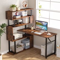 a computer desk with bookshelves and a monitor on it in front of a window