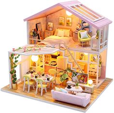 a doll house with furniture and flowers in the foreground, on a pink background