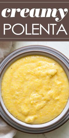 a bowl filled with creamy polenta on top of a table